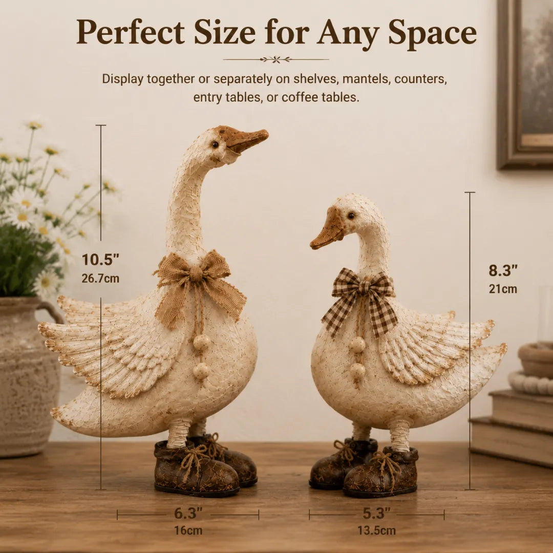 Cream farmhouse goose pair on a rustic table by a sunny window
